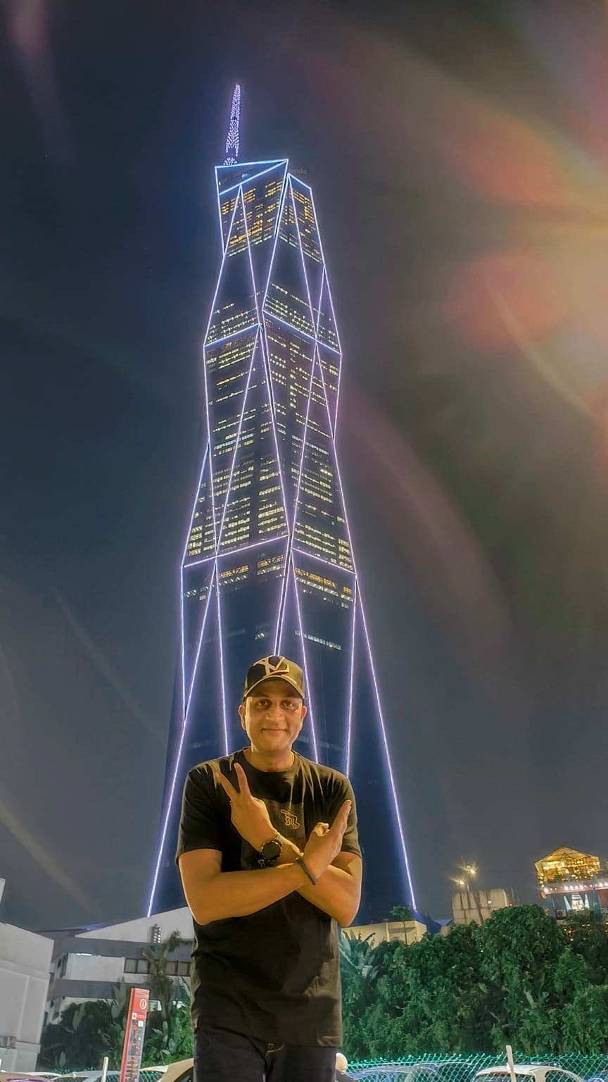 Portrait in front of tower (alt)